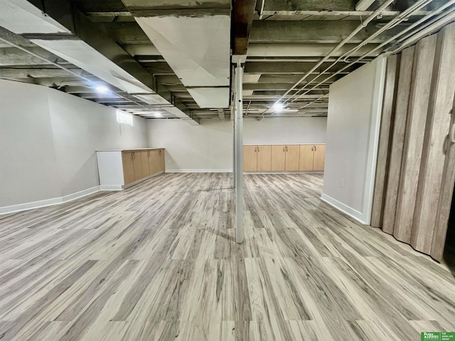 2864 Spaulding St, Omaha, NE 68111 - below grade area with wood finished floors and baseboards