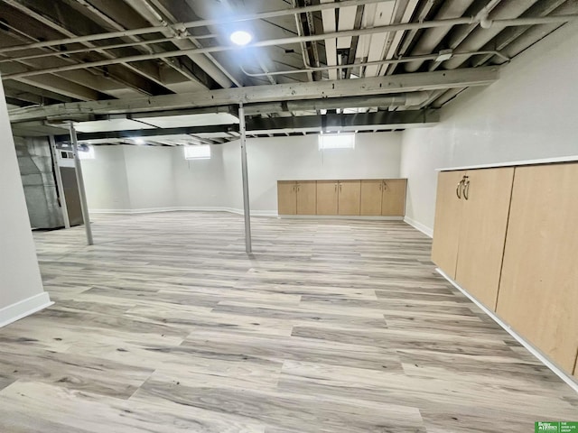 2864 Spaulding St, Omaha, NE 68111 - basement with light wood-style floors and baseboards