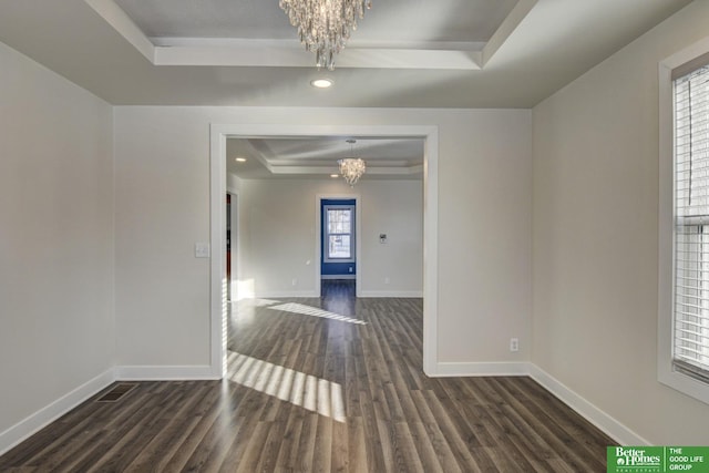 2864 Spaulding St, Omaha, NE 68111 - spare room featuring a chandelier, a tray ceiling, dark wood-style flooring, baseboards, and recessed lighting