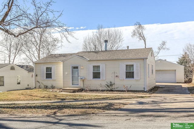 830 N 78th St, Omaha, NE 68114 - view of front of house with a garage and an outbuilding