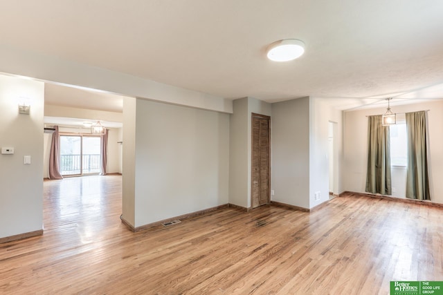 830 N 78th St, Omaha, NE 68114 - spare room featuring healthy amount of natural light, light wood-type flooring, and baseboards
