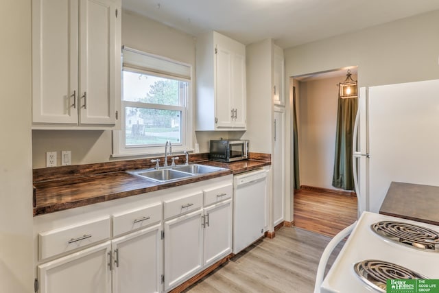 830 N 78th St, Omaha, NE 68114 - kitchen with white appliances, a sink, light wood-type flooring, white cabinets, and butcher block counters