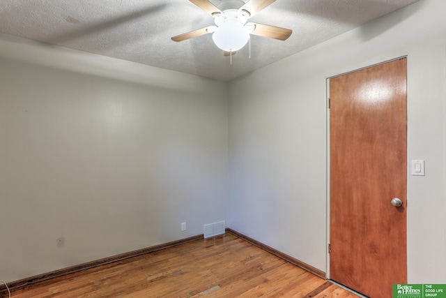 830 N 78th St, Omaha, NE 68114 - empty room with wood finished floors, ceiling fan, baseboards, and a textured ceiling
