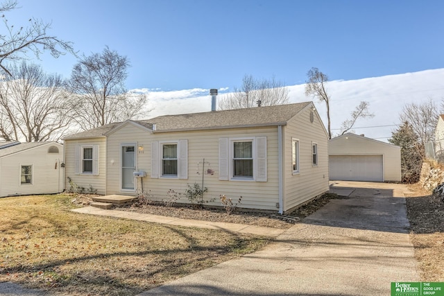 830 N 78th St, Omaha, NE 68114 - view of front of house with a garage, an outbuilding, and a shingled roof