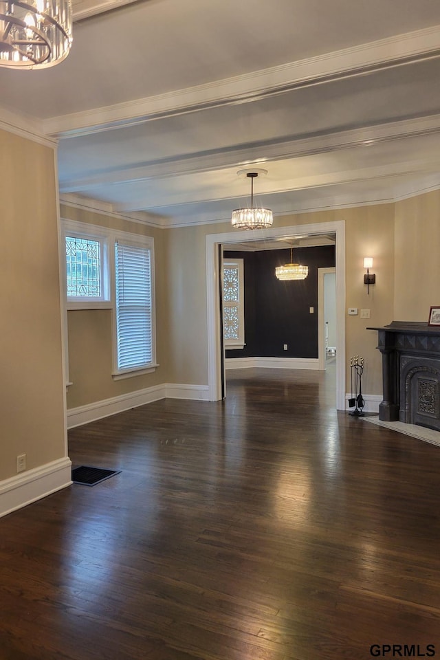 1205 N Broad St, Fremont, NE 68025 - unfurnished living room featuring a chandelier, wood finished floors, ornamental molding, baseboards, and beam ceiling