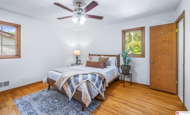 1439 S 123rd St, Omaha, NE 68144 - bedroom with light wood-style flooring, baseboards, and a ceiling fan