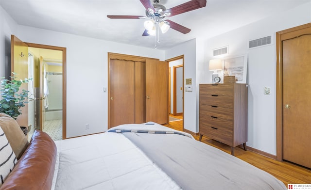 1439 S 123rd St, Omaha, NE 68144 - bedroom with light wood-type flooring, baseboards, ensuite bath, and ceiling fan