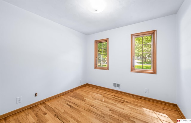 1439 S 123rd St, Omaha, NE 68144 - empty room featuring baseboards and light wood-type flooring