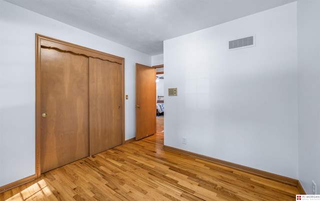 1439 S 123rd St, Omaha, NE 68144 - unfurnished bedroom featuring light wood-style flooring, baseboards, and a closet
