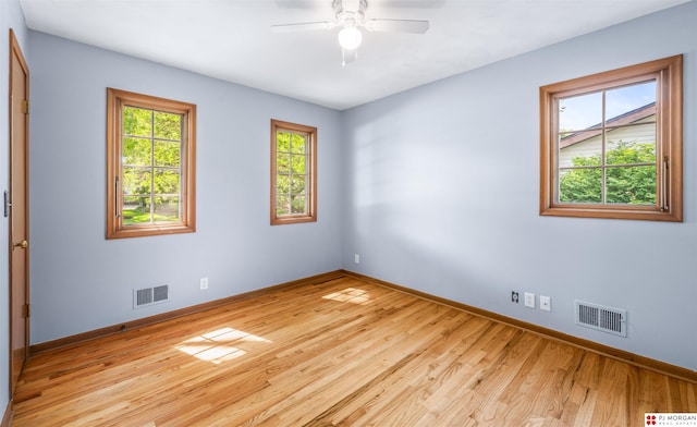 1439 S 123rd St, Omaha, NE 68144 - spare room featuring baseboards, light wood finished floors, and ceiling fan