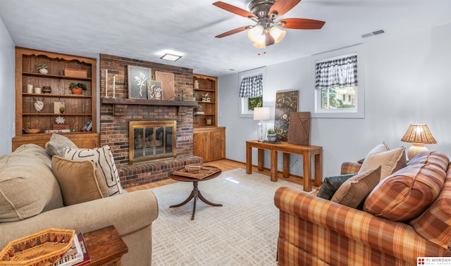 1439 S 123rd St, Omaha, NE 68144 - living area with ceiling fan, built in features, a brick fireplace, and wood finished floors