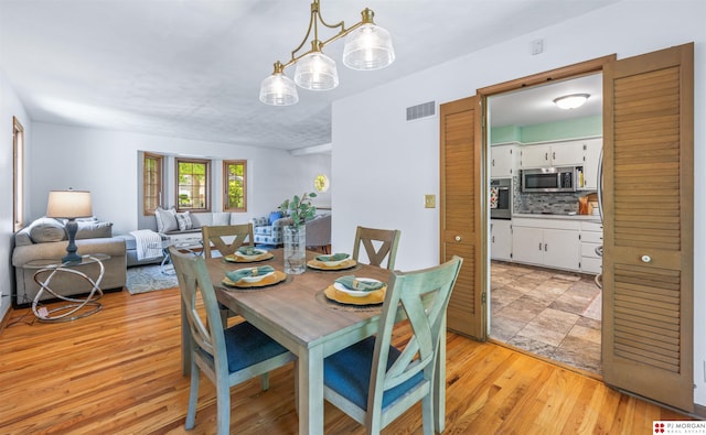 1439 S 123rd St, Omaha, NE 68144 - dining room with light wood-style floors