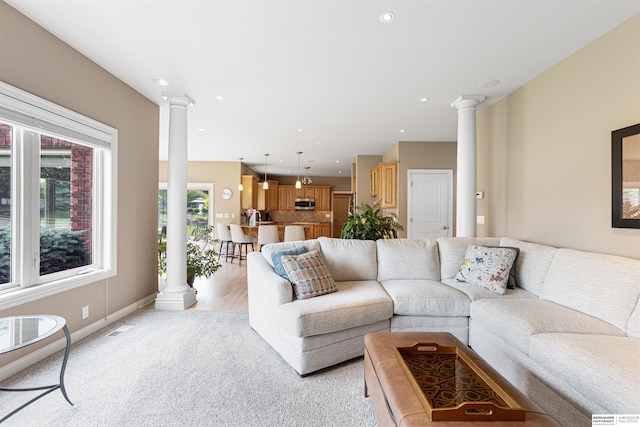 13303 Cuming St, Omaha, NE 68154 - living room featuring decorative columns, light carpet, recessed lighting, and baseboards