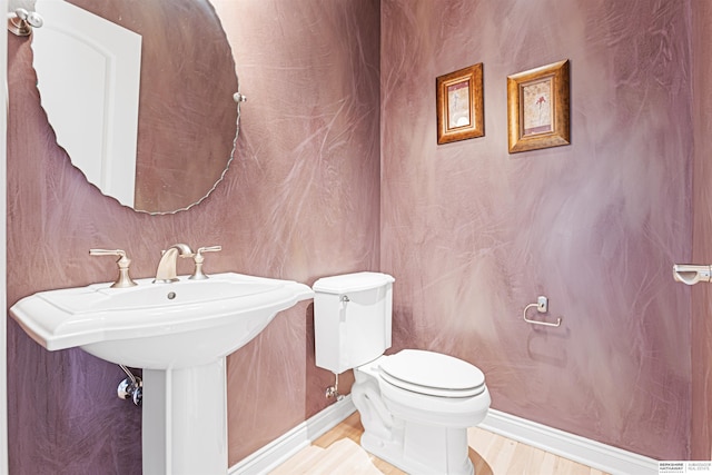 13303 Cuming St, Omaha, NE 68154 - bathroom featuring toilet, wood finished floors, and baseboards
