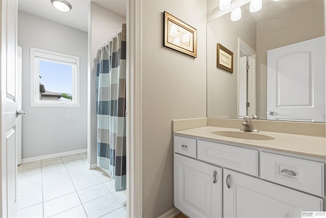 13303 Cuming St, Omaha, NE 68154 - bathroom with vanity, tile patterned floors, baseboards, and a shower with curtain
