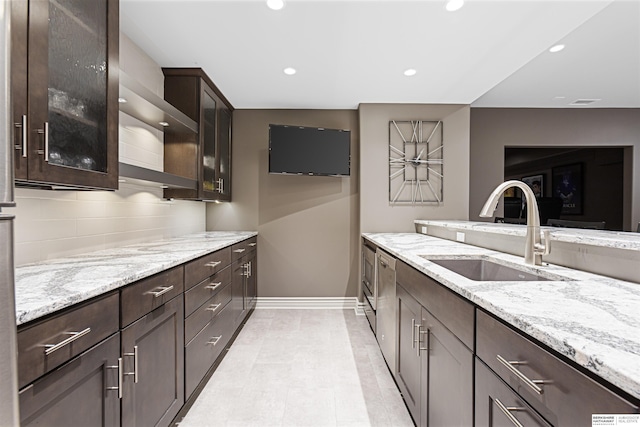 13303 Cuming St, Omaha, NE 68154 - kitchen with a sink, dark brown cabinetry, light stone countertops, and recessed lighting