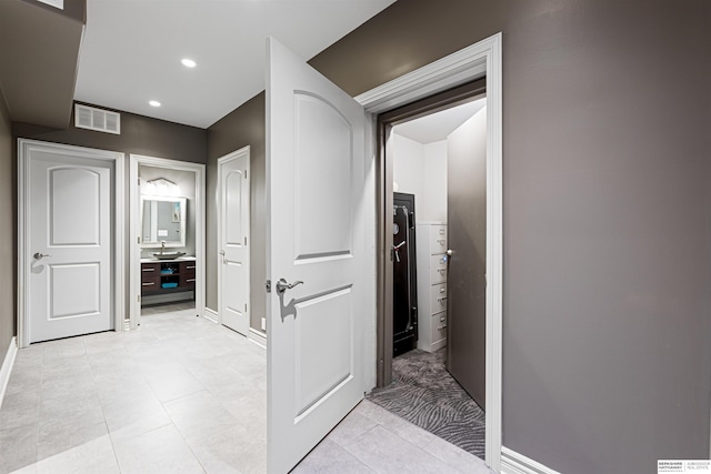 13303 Cuming St, Omaha, NE 68154 - hallway featuring baseboards, recessed lighting, and light tile patterned floors