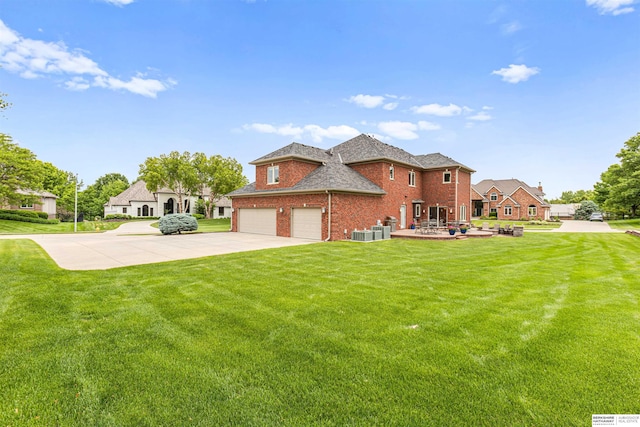 13303 Cuming St, Omaha, NE 68154 - view of front facade with brick siding, a front lawn, driveway, and cooling unit