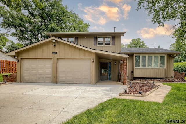 5617 S 93rd St, Omaha, NE 68127 - view of front of home featuring driveway, a garage, and a shingled roof