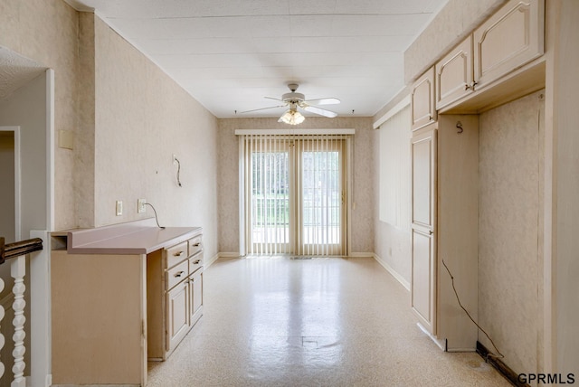 5617 S 93rd St, Omaha, NE 68127 - kitchen featuring ceiling fan, light countertops, and baseboards