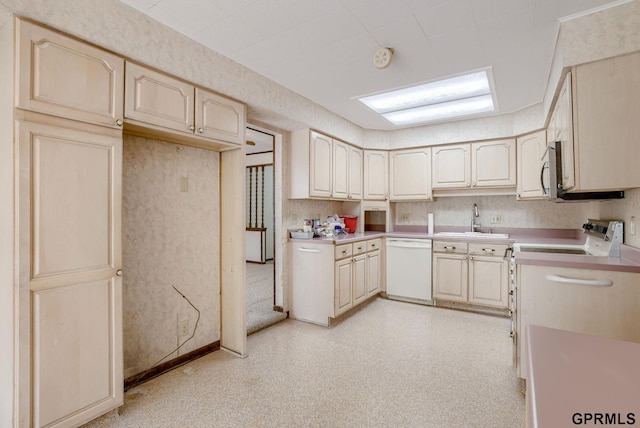 5617 S 93rd St, Omaha, NE 68127 - kitchen with dishwasher, a sink, light countertops, and range