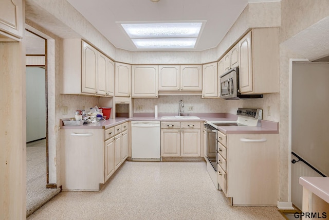 5617 S 93rd St, Omaha, NE 68127 - kitchen featuring white appliances, a sink, and light countertops