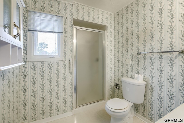 5617 S 93rd St, Omaha, NE 68127 - bathroom with a stall shower, toilet, tile patterned flooring, and baseboards