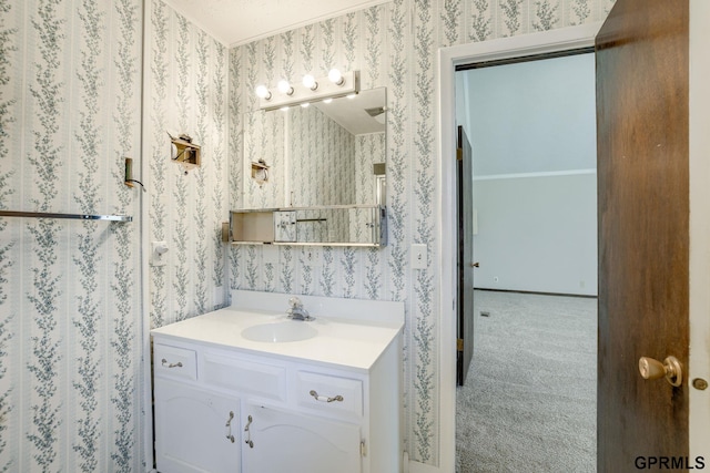 5617 S 93rd St, Omaha, NE 68127 - bathroom featuring wallpapered walls and vanity