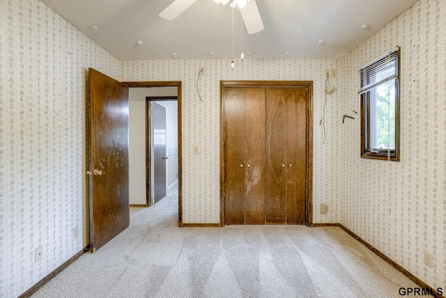5617 S 93rd St, Omaha, NE 68127 - unfurnished bedroom with carpet flooring, wallpapered walls, a closet, and ceiling fan