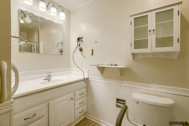 5617 S 93rd St, Omaha, NE 68127 - bathroom with toilet, wainscoting, and vanity