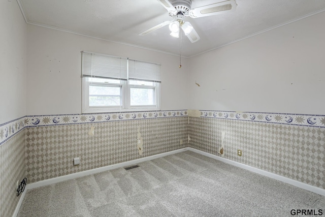 5617 S 93rd St, Omaha, NE 68127 - spare room featuring carpet floors, wainscoting, ceiling fan, ornamental molding, and wallpapered walls