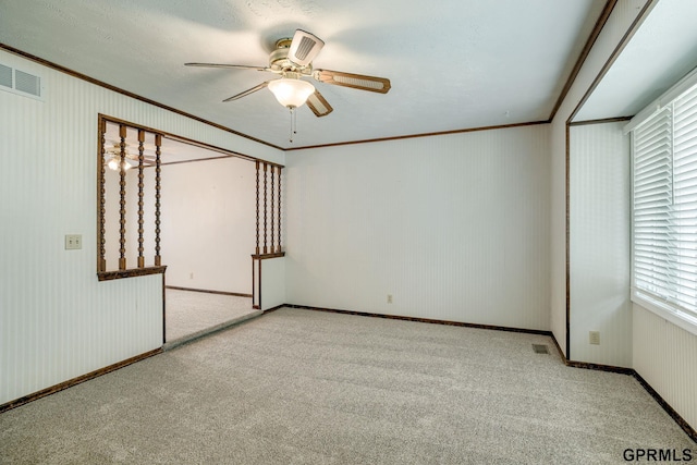 5617 S 93rd St, Omaha, NE 68127 - carpeted spare room featuring ornamental molding, a ceiling fan, and baseboards
