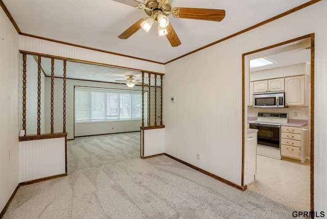 5617 S 93rd St, Omaha, NE 68127 - unfurnished room featuring ornamental molding, baseboards, a ceiling fan, and light carpet