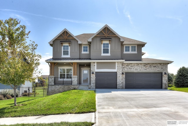 19920 Tyler St, Omaha, NE 68135 - craftsman house featuring stone siding, board and batten siding, concrete driveway, an attached garage, and a porch