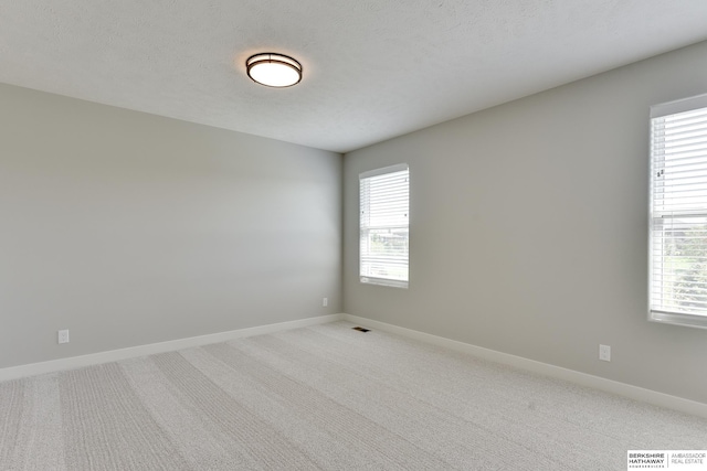 19920 Tyler St, Omaha, NE 68135 - spare room featuring light colored carpet and baseboards