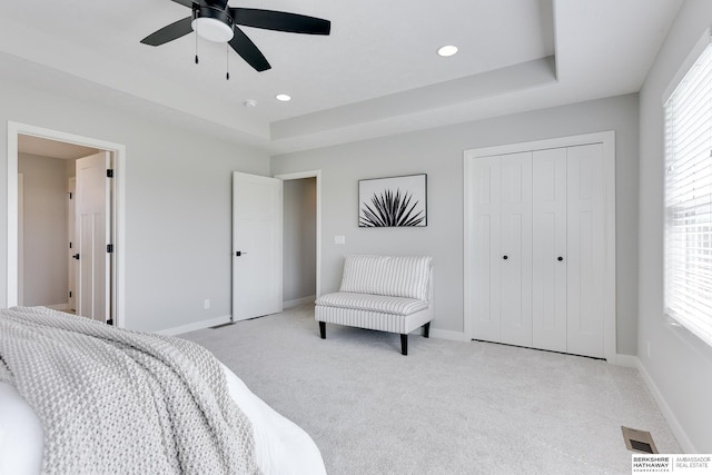 19920 Tyler St, Omaha, NE 68135 - bedroom with carpet flooring, a tray ceiling, multiple windows, recessed lighting, and baseboards