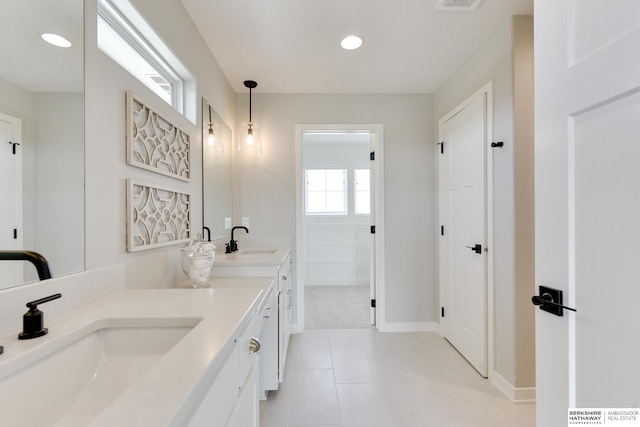 19920 Tyler St, Omaha, NE 68135 - bathroom featuring double vanity, recessed lighting, tile patterned floors, baseboards, and a closet