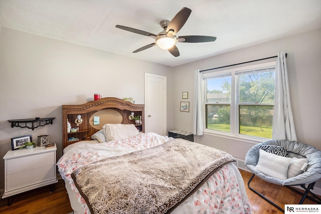 6021 Frederick St, Omaha, NE 68106 - bedroom with dark wood finished floors and a ceiling fan
