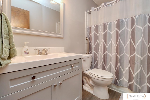 4115 N 45th Street Ct, Lincoln, NE 68504 - full bath with vanity, toilet, wood finished floors, and curtained shower