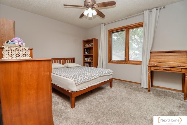 4115 N 45th Street Ct, Lincoln, NE 68504 - carpeted bedroom featuring a textured ceiling, baseboards, and ceiling fan