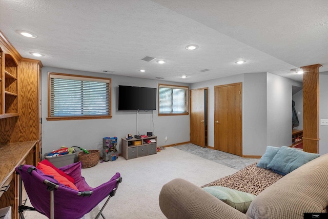 918 N 150th St, Omaha, NE 68154 - living room with a textured ceiling, recessed lighting, baseboards, and light colored carpet
