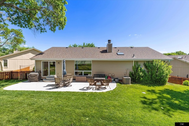 918 N 150th St, Omaha, NE 68154 - back of house featuring a patio, a chimney, and a shingled roof