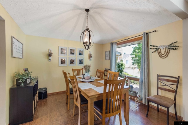 918 N 150th St, Omaha, NE 68154 - dining room featuring a chandelier, a textured ceiling, wood finished floors, and baseboards