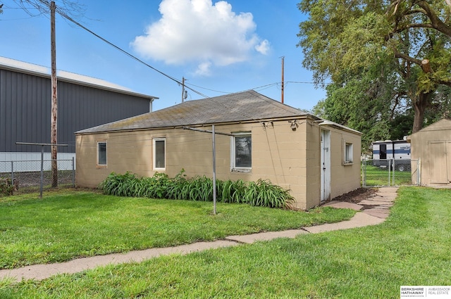 209 S Vine St, Mead, NE 68041 - view of home's exterior featuring concrete block siding and roof with shingles