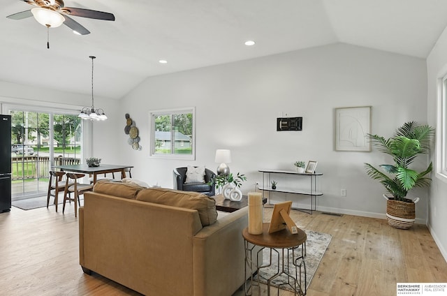 209 S Vine St, Mead, NE 68041 - living room with vaulted ceiling, a ceiling fan, light wood-style floors, plenty of natural light, and a chandelier
