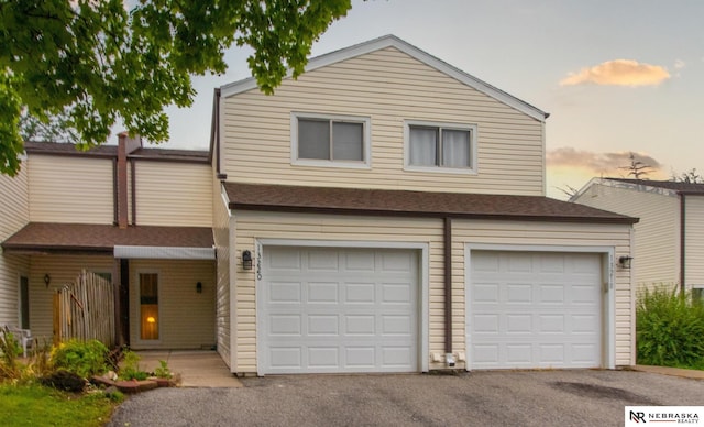 13220 Carpenter St, Omaha, NE 68138 - view of front of house featuring driveway and an attached garage