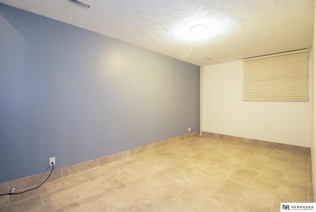 13220 Carpenter St, Omaha, NE 68138 - empty room featuring a textured ceiling and baseboards