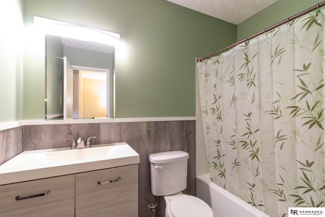 13220 Carpenter St, Omaha, NE 68138 - full bath with vanity, toilet, shower / tub combo, and wainscoting