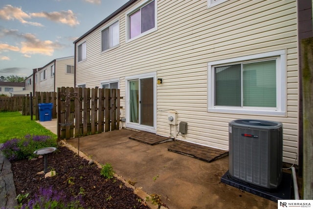 13220 Carpenter St, Omaha, NE 68138 - rear view of house featuring cooling unit and a patio area