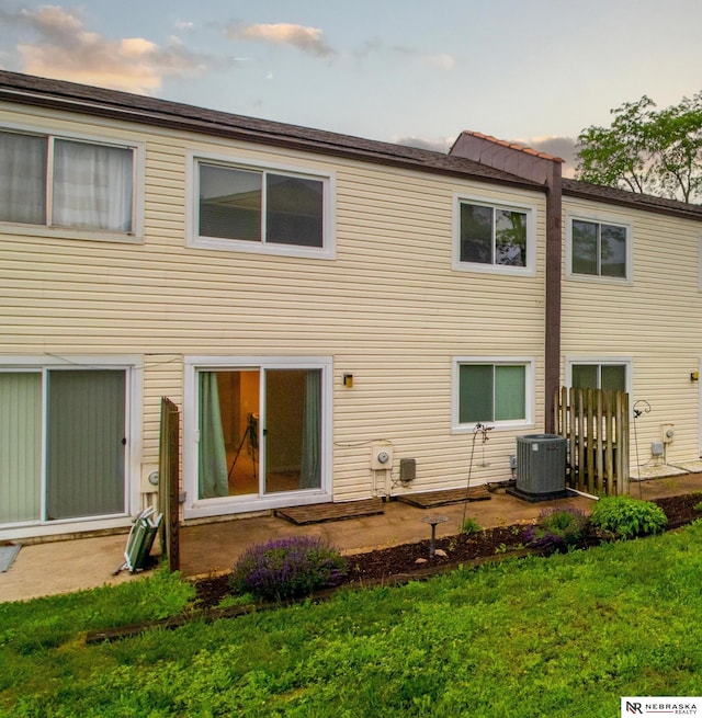 13220 Carpenter St, Omaha, NE 68138 - back of property featuring central AC unit and a yard